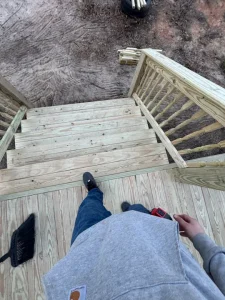 Newly constructed front porch and steps.