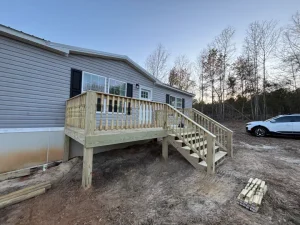 Newly constructed front porch and steps.