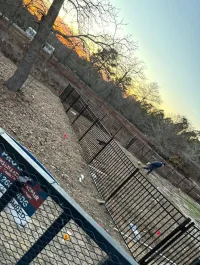 In the middle of a iron fence installation in a residential backyard.